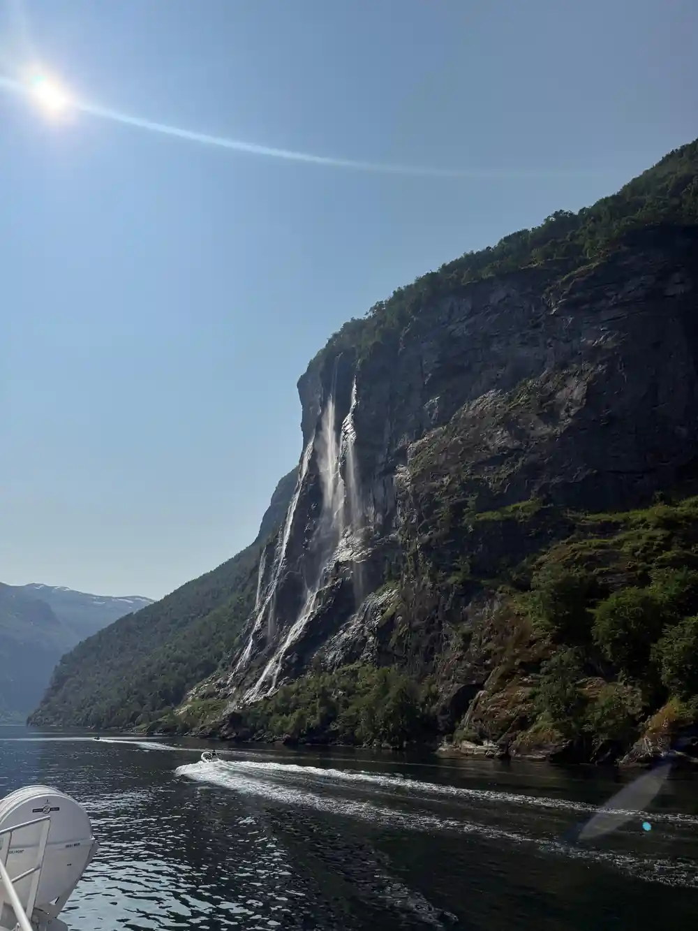 Double waterfall cascading down steep mountainside fjord