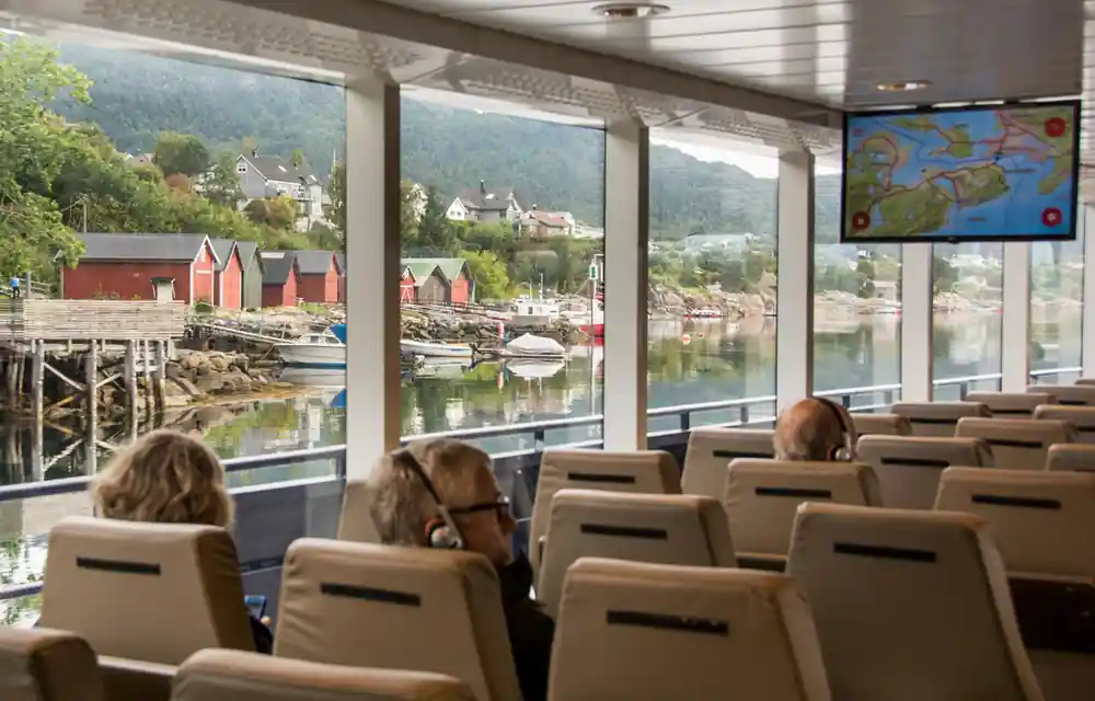 Interior of tour coach with mountain lake view