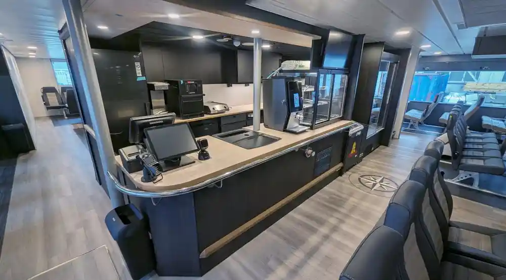 Modern ferry interior with service counter and seating
