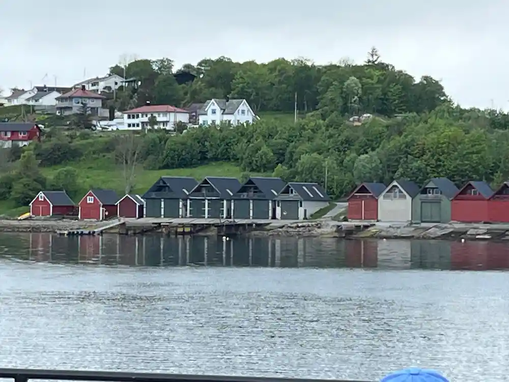 Red and white traditional houses reflected in still water