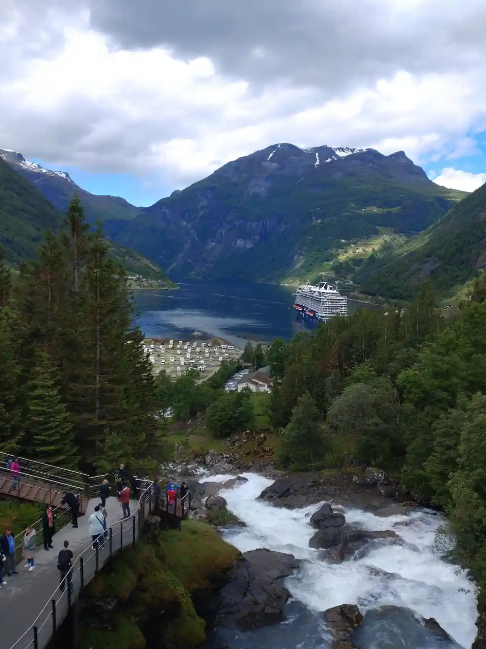 Viewpoint overlooking fjord with white water rapids below